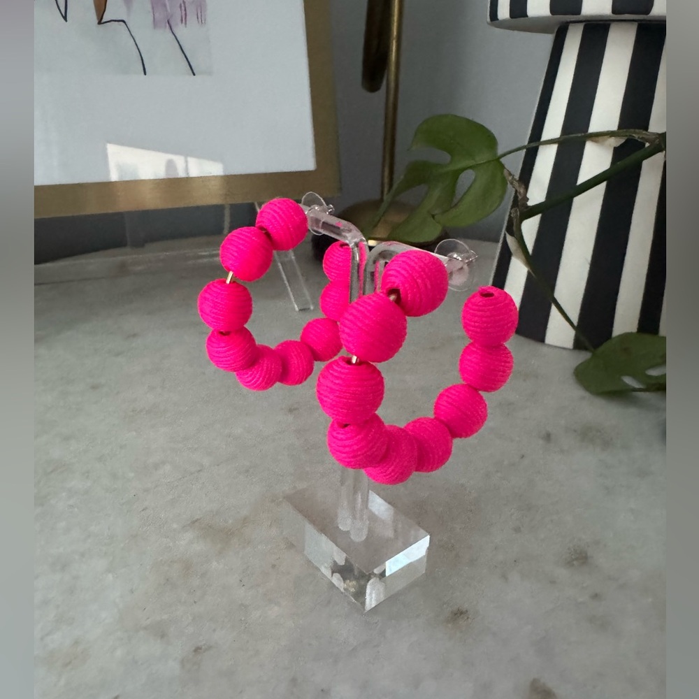 Hot pink pom pom hoop earrings